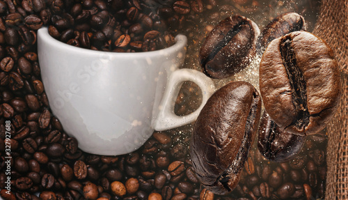background with coffee beans falling on a cup of coffee