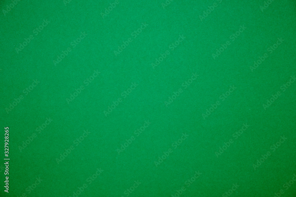 Bright green background.Red cardboard texture. Bright green background.Red cardboard texture.