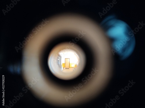 Fotografija View to the hall through peephole eyelet in the door. Slovakia