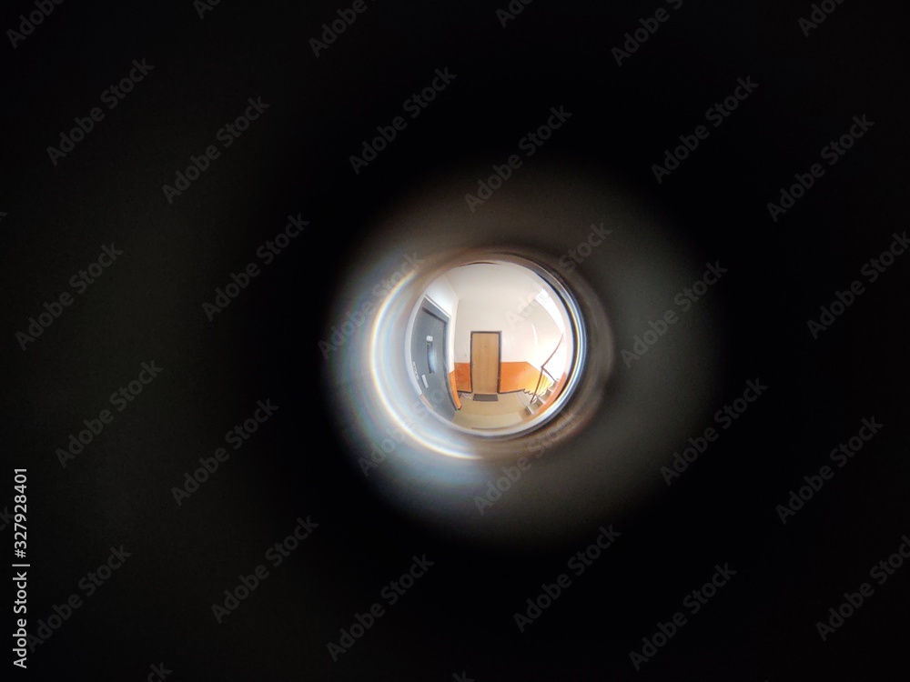 View to the hall through peephole eyelet in the door. Slovakia