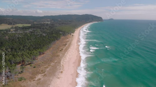 Aerial shot of a beautiful surf beach in the Coromandel, New Zealand photo