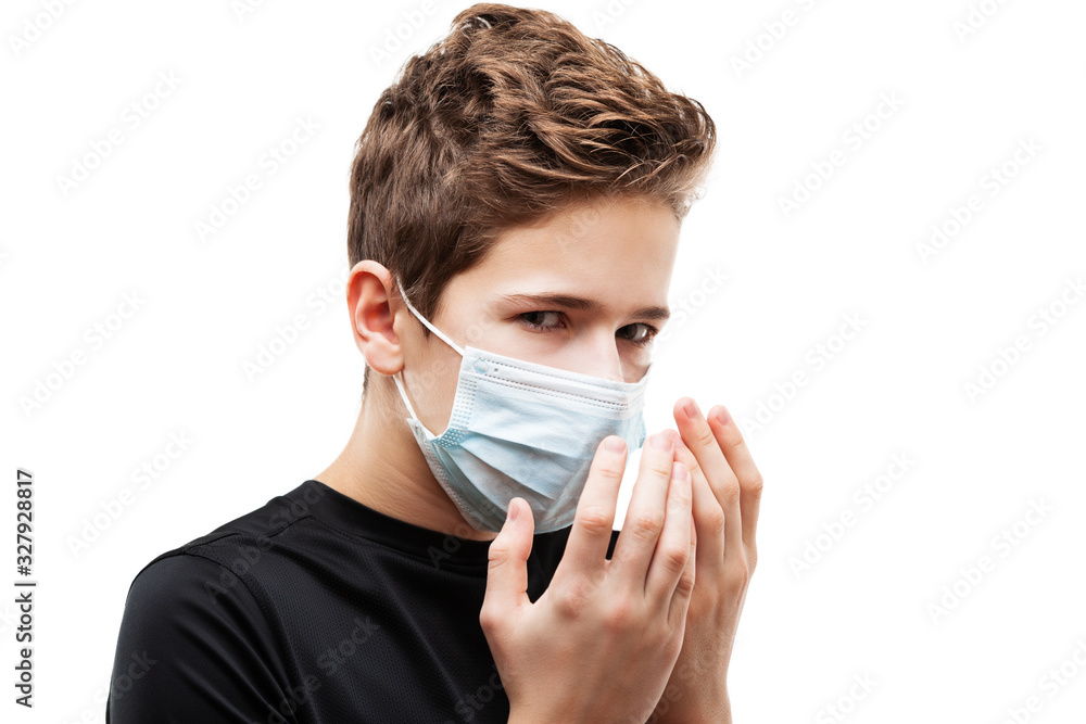 Teenager boy wearing respiratory protective medical mask Teenager boy wearing respiratory protective medical mask