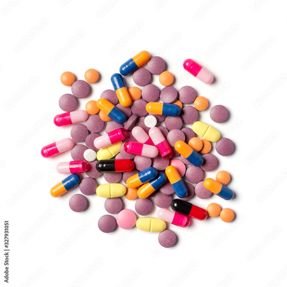 Top view of different colored pills and capsules