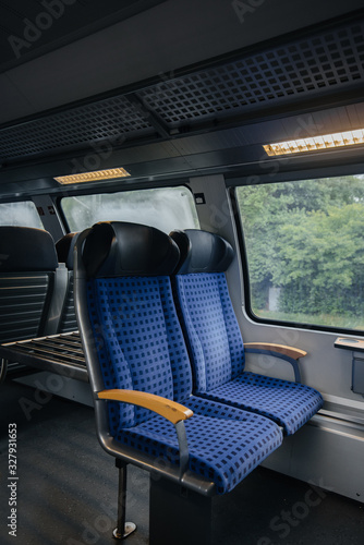 Comfortable and beautiful blue seats in the train. Transport. Travels. © Andrii