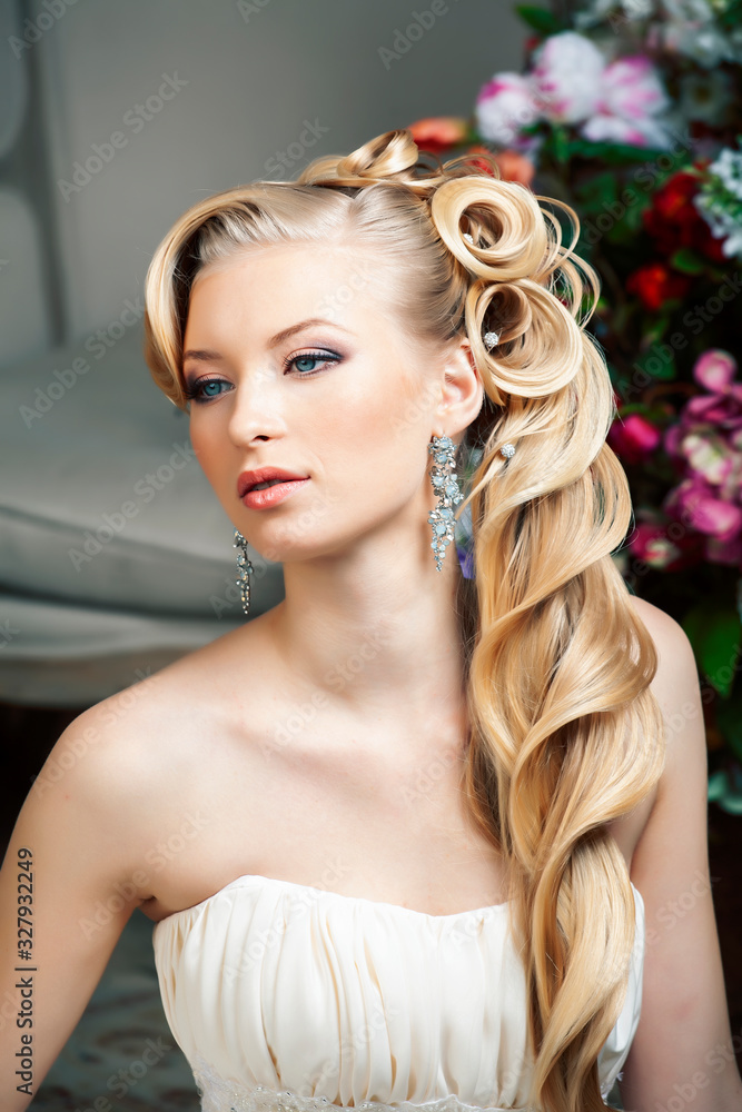 beauty young bride alone in luxury vintage interior with a lot of flowers, makeup and creative hairstyle