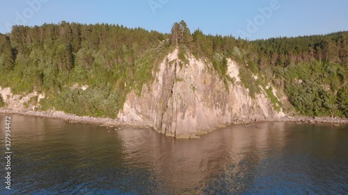 Aerial: Fly-over of a beautiful rocky coastline, New Zealand photo