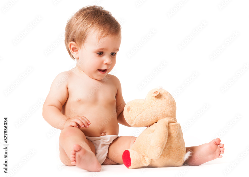 Front view of adorable kid playing with bear toy. Isolated on white studio background. Concept of educational toy. Front view of adorable kid playing with bear toy. Isolated on white studio background. Concept of educational toy.