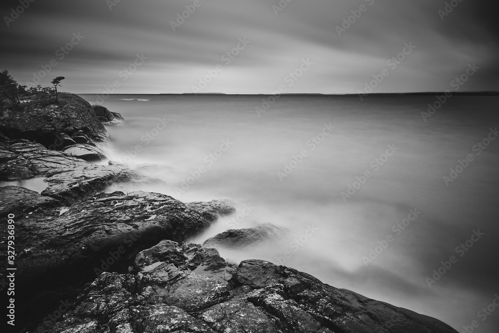 Long exposure Black and white photo of cliffs and lake