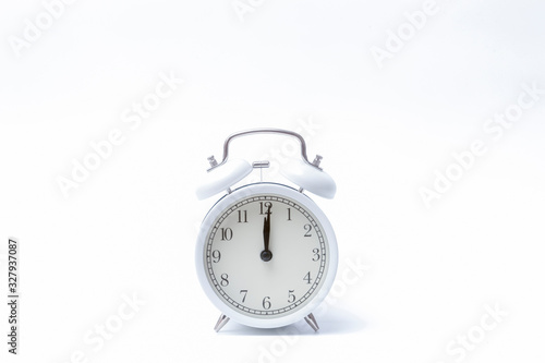 Retro alarm clock or vintage alarm clock isolated on white background