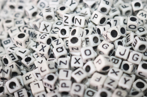 white dice/cubes on letters