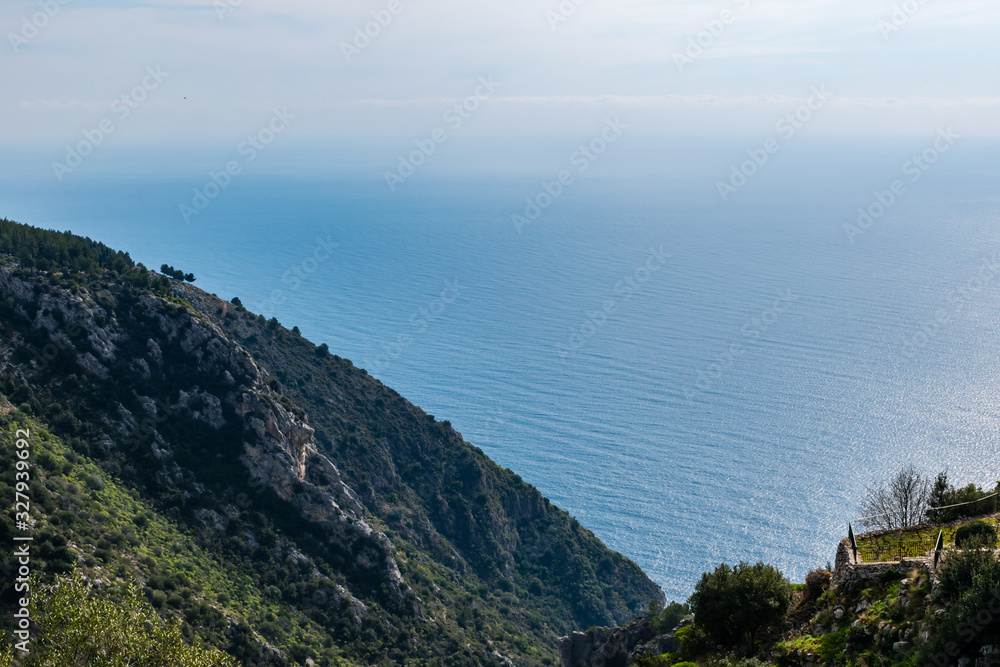 The panoramic view of the Mediterranean Sea and the Alps mountains cliffs on a sunny day (Provence Côte d'Azur, France)