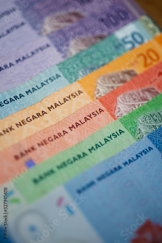 Malaysia currency of Malaysian ringgit banknotes background. Paper money of ten, twenty, fifty and hundred ringgit notes. Financial concept.