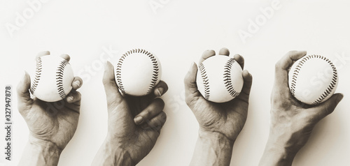 Photography Old vintage baseball banner with hands holding balls.