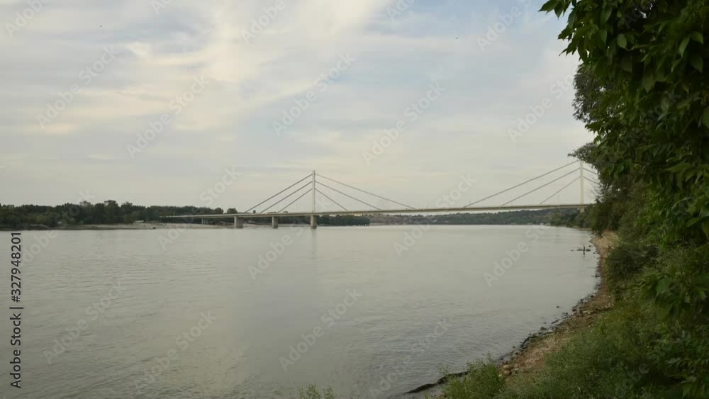Timelapse of a bridgeon a Danube river