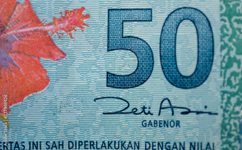 Malaysia currency of Malaysian ringgit banknotes background. Paper money of fifty ringgit notes on etreme closeup. Financial concept. photo