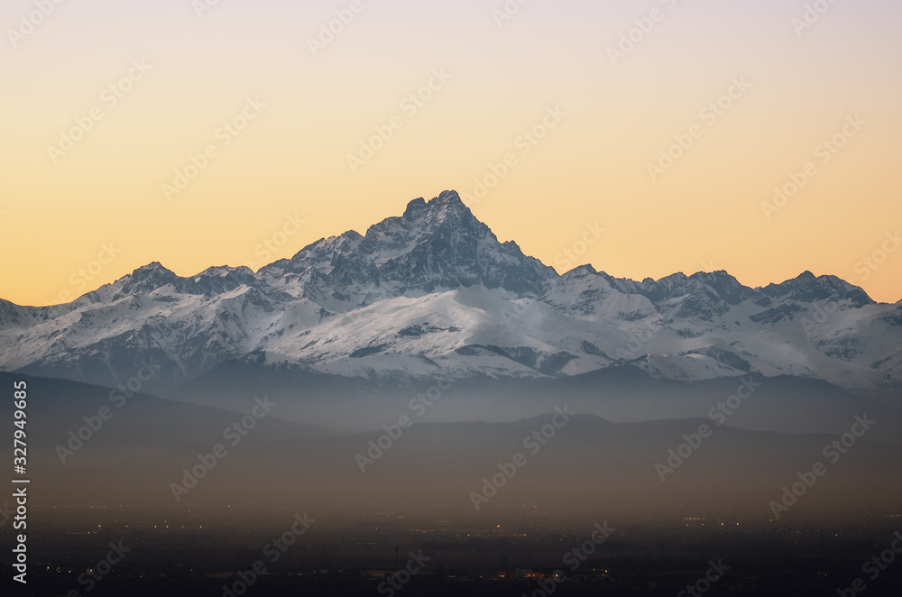 the Mount Viso (Monviso), one of the main peaks of the piedmontese Alps (Italy) seen from the town of Mondovi at sunset
