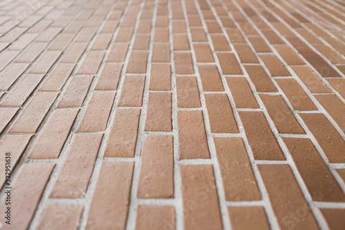 brown ceramic brick wall with leakage point and selective focus, for background or building material resource