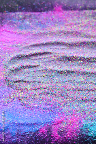 Multicolor powder explosion on black background. Colorful dust explode. Paint Holi.