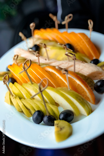 fresh fruit salad with olives and cheese
