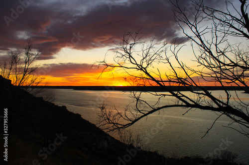 Sunset over lake with silhouette