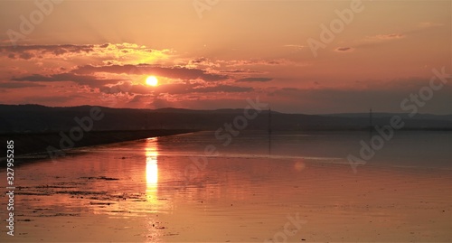 Beautiful golden sunset with reflection in the river water © DUTULESCU