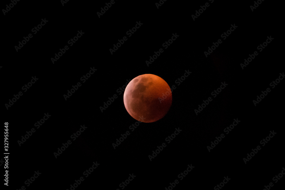 Blood moon, red full moon against a black sky