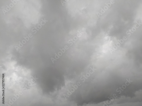 Sky with gray clouds, background, thunderclouds, unstable changeable weather. Sky before the rain. © Olga