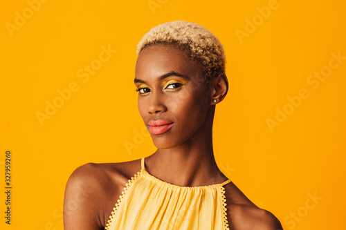 Canvas-taulu Beauty portrait of a beautiful young woman with bright yellow eye shadow make up