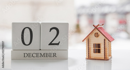 December calendar and toy home. Day 2 of month. Card message for print or remember