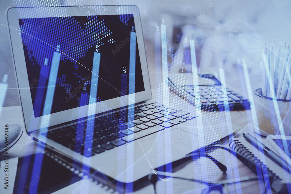 Stock market graph on background with desk and personal computer. Double exposure. Concept of financial analysis. Stock market graph on background with desk and personal computer. Double exposure. Concept of financial analysis.