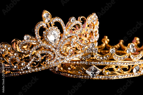 Golden Crowns Isolated on a Black Background