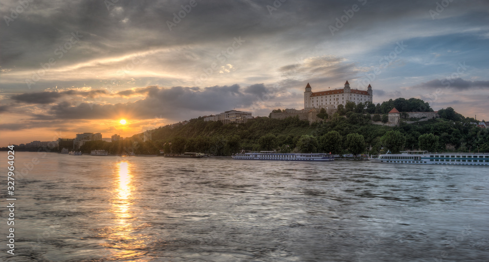Colorful Sunset in the Flooded City with the Castle on the Hill and Ships on the River