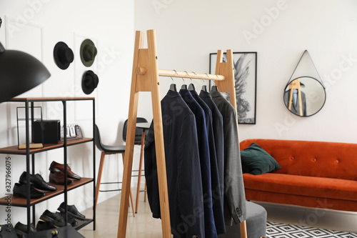 Rack with stylish male clot...