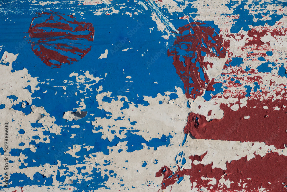 Naklejka premium texture of old peeling paint, vintage background, cracked paint, old paint, traces of red, white and blue