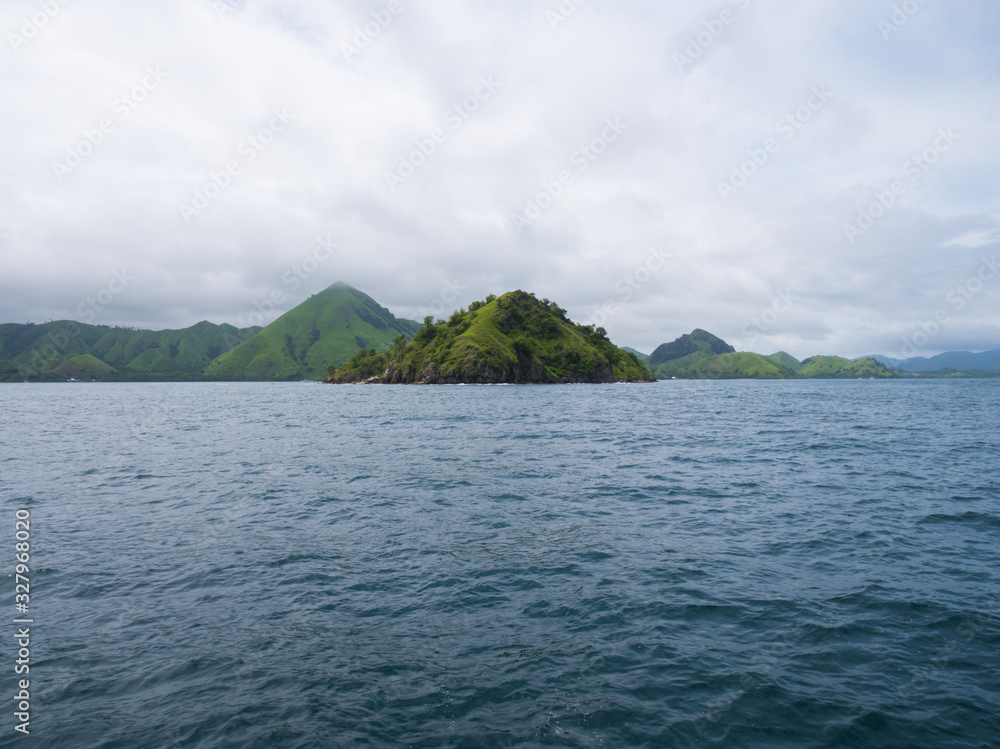 Komodo Islands off coast of Flores, view from Liveaboard boat Komodo Islands off coast of Flores, view from Liveaboard boat