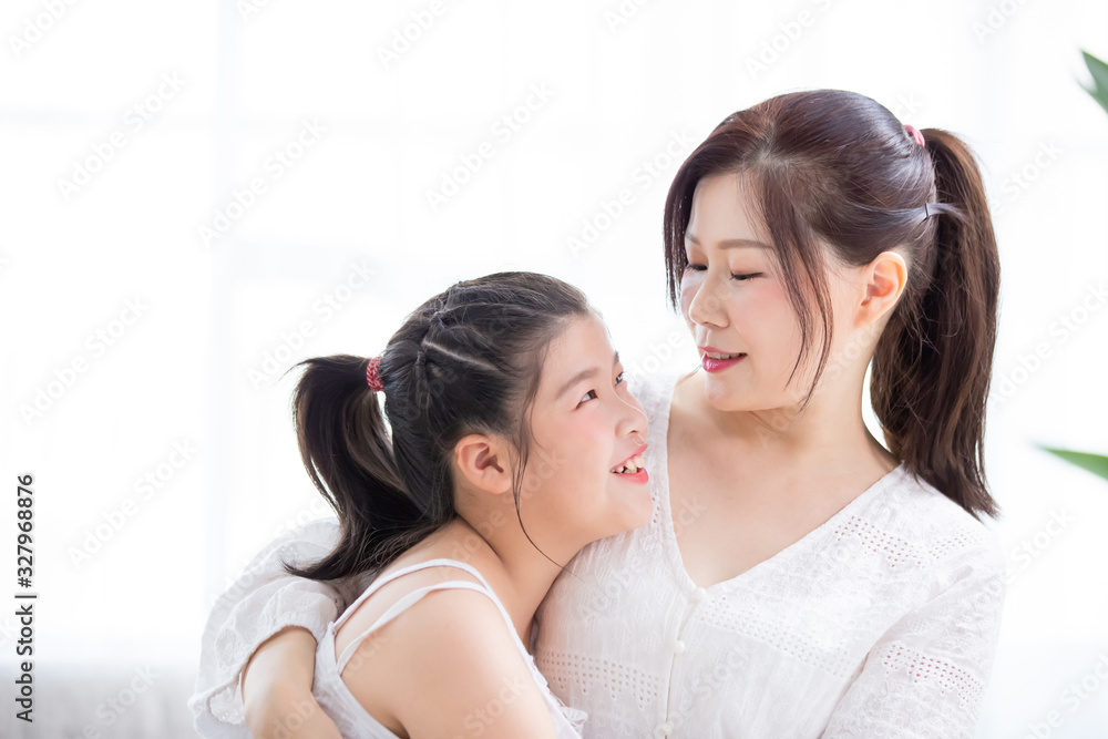 Mom hold daughter in her arm