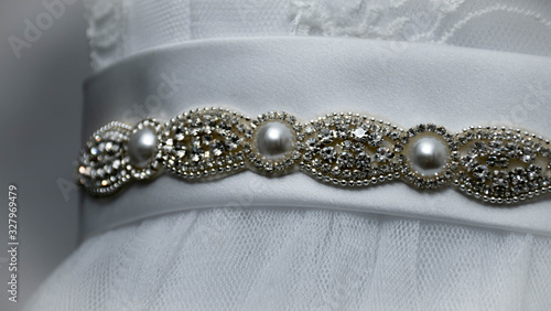 Closeup of the beads and jewels on a wedding dress