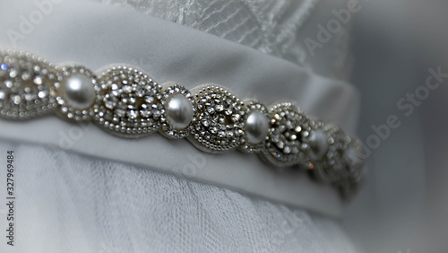 Closeup of the jewels on a wedding dress