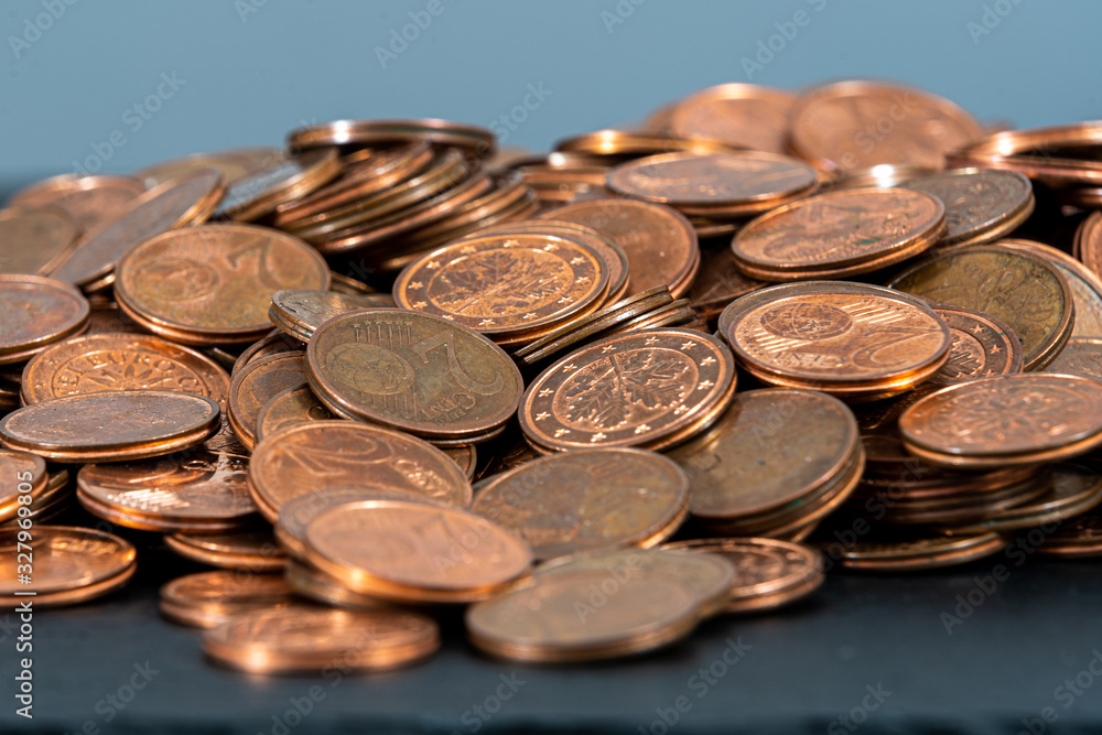 One, two euro cents coins on dark background. European money. One, two euro cents coins on dark background. European money.