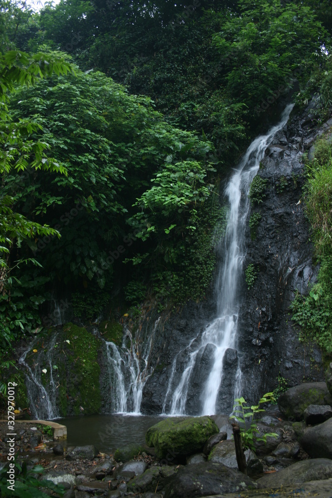 waterfall in the middle of the forest. waterfall 