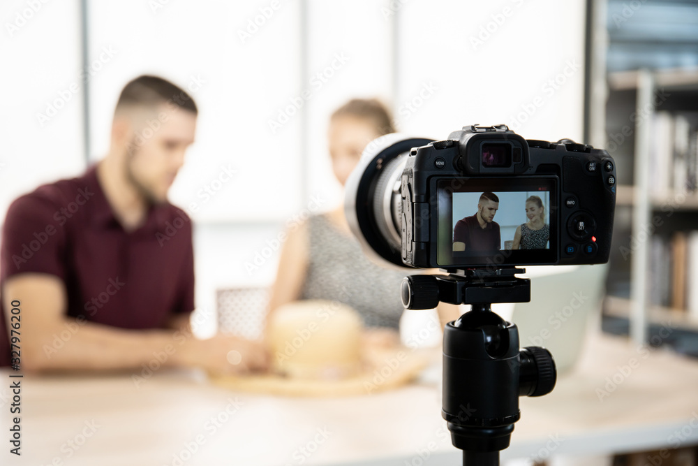 Young caucasian fashion bloggers live streaming and broadcast on social media. Two fashion blogger enjoy talking together in front of the digital camera. Modern lifestyle and social media concept.