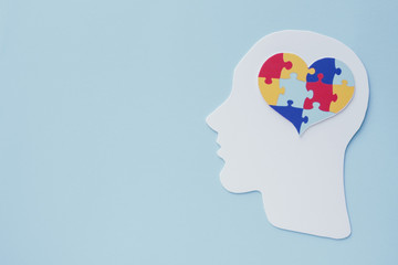 puzzle jigsaw heart on brain,  mental health concept, world autism awareness day