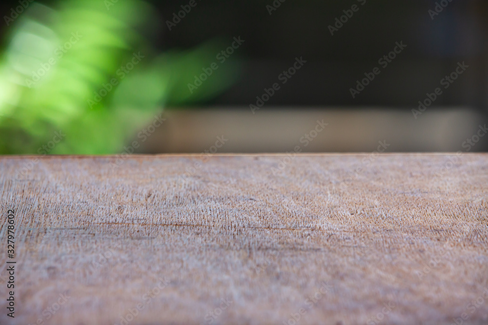 Empty wooden table texture, Green garden blurred bokeh background, Selective focus Empty wooden table texture, Green garden blurred bokeh background, Selective focus