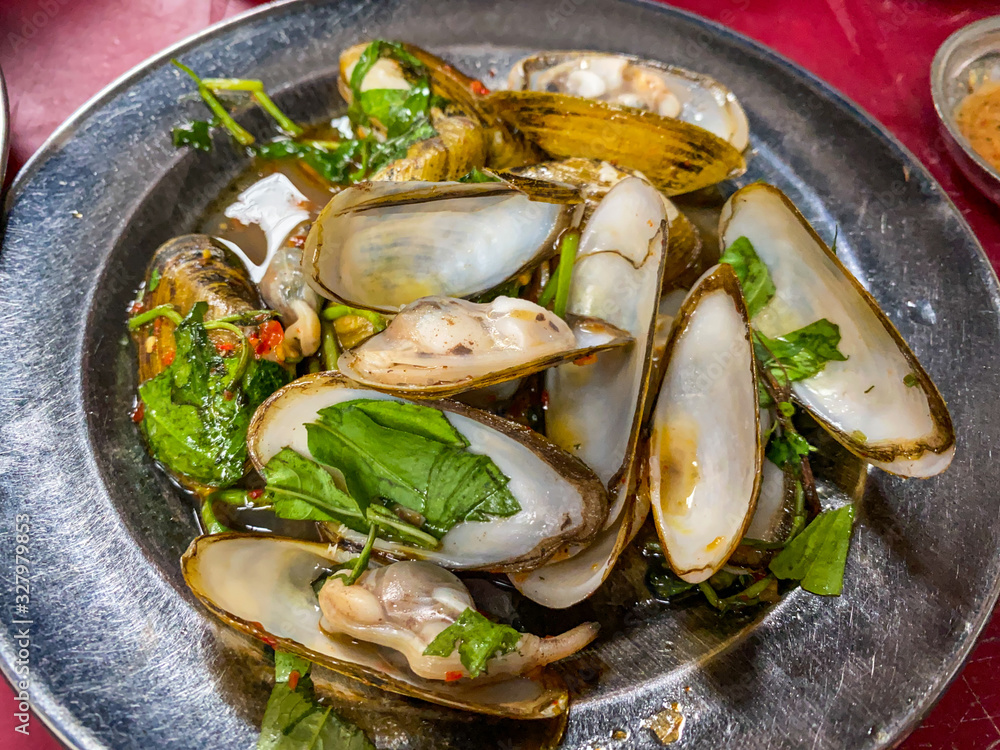 Vietnamese delicious street food- sauteed mussels with tamarind sauce Vietnamese delicious street food- sauteed mussels with tamarind sauce