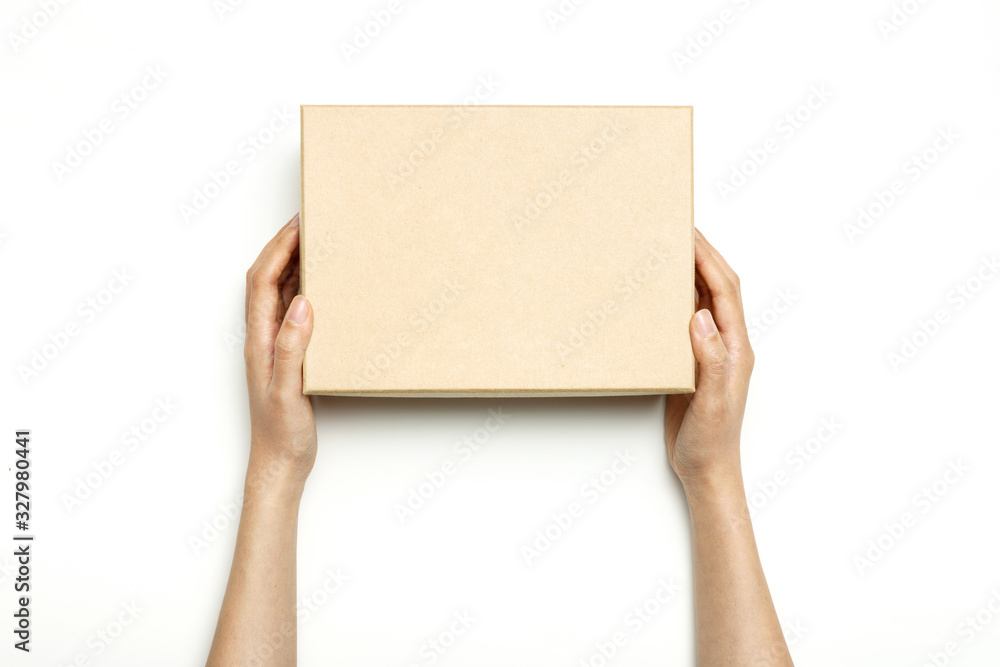 Woman hand hold a craft box isolated on white. Woman hand hold a craft box isolated on white.