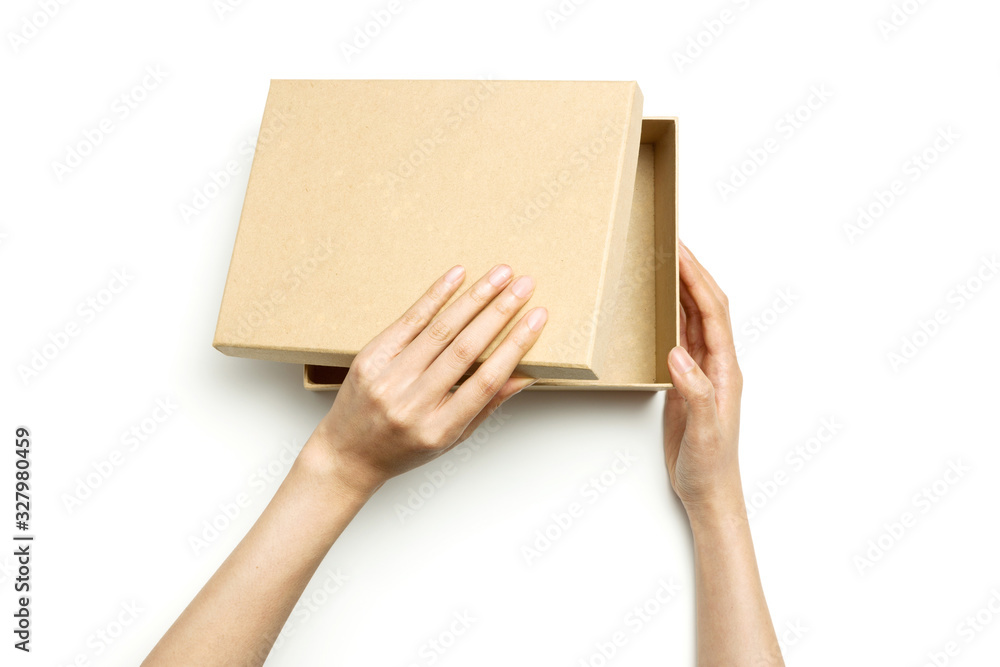Woman hand hold a craft box isolated on white. Woman hand hold a craft box isolated on white.