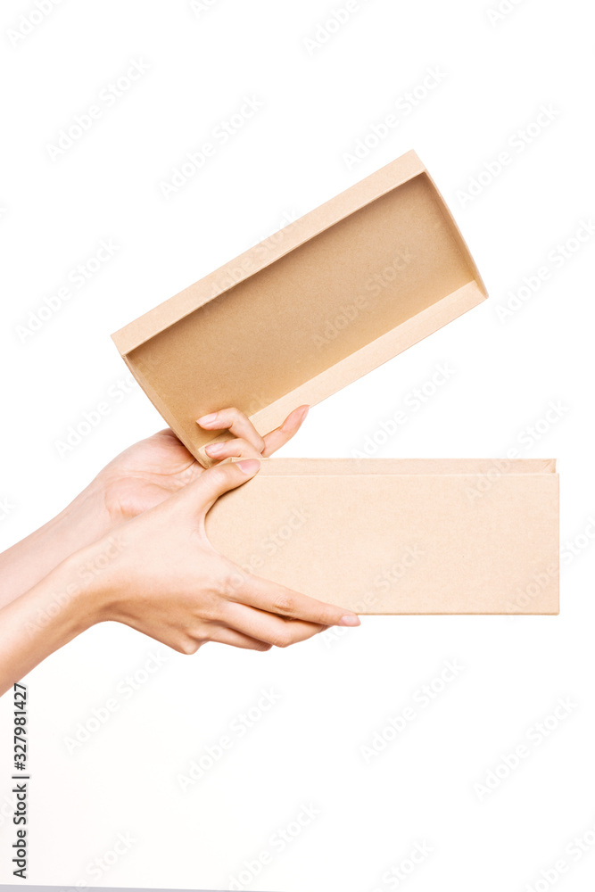 Woman hand hold a craft box isolated on white. Woman hand hold a craft box isolated on white.