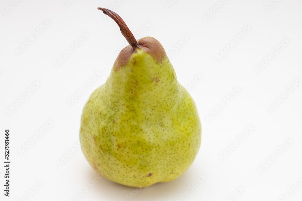 green ripe pear on a white background