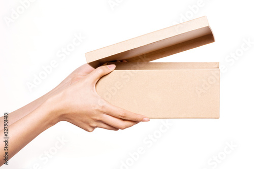 Woman hand hold a craft box isolated on white.