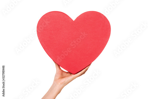 Woman hand hold a heart box isolated on white.